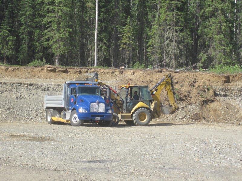 Our Dump Truck and Backhoe working together